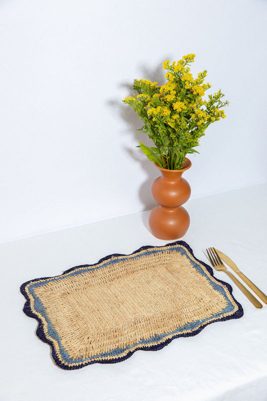 Handmade natural raffia placemats with blue edges, Payton James rectangular table tops on Tampa Home & Garden Store
