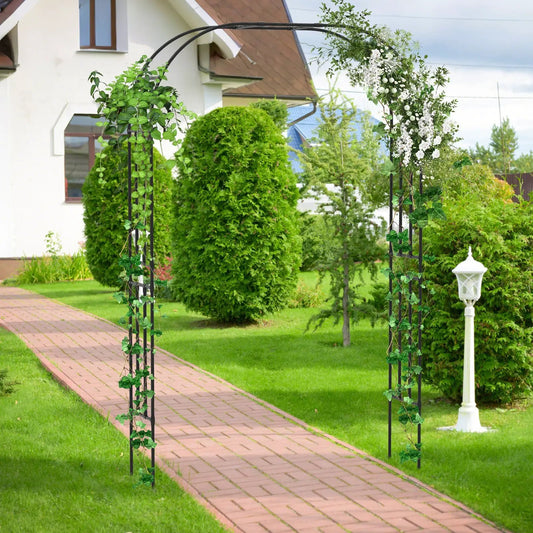 Black metal garden arch trellis with lush ivy and cascading white blossoms on Tampa Home & Garden Store