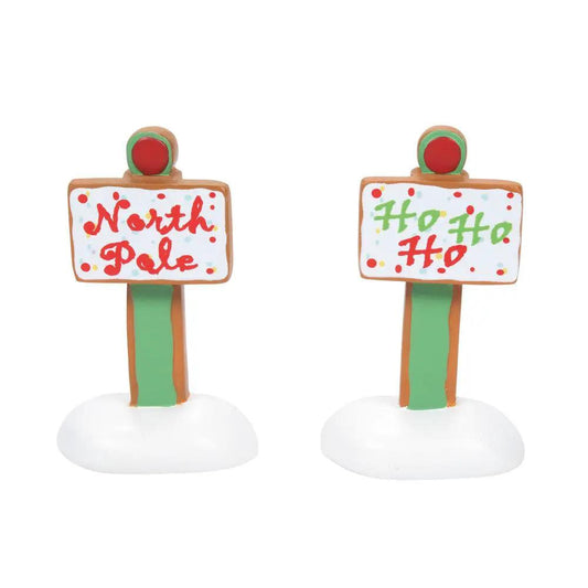 Gingerbread Christmas signs set of 2 with white panels, red/green text, green posts on bases, on Tampa Home & Garden Store