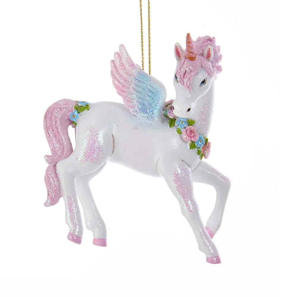 Glittered unicorn ornament with pink mane, blue wings and floral garland on gold string on Tampa Home & Garden Store