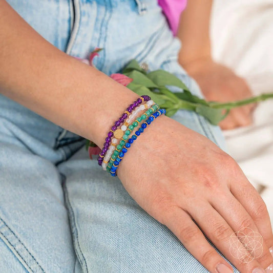 Good Karma bracelet set 4-pack by Conscious Items, colorful beaded bracelets on wrist on Tampa Home & Garden Store