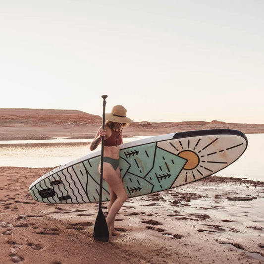 GrandSol Canyon Pack Inflatable Paddle Board Kit with sunburst graphic on a sandy beach on Tampa Home & Garden Store