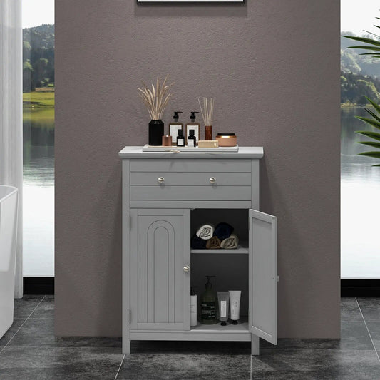 Freestanding bathroom storage cabinet with drawer in gray, top bottles and reed diffuser on Tampa Home & Garden Store
