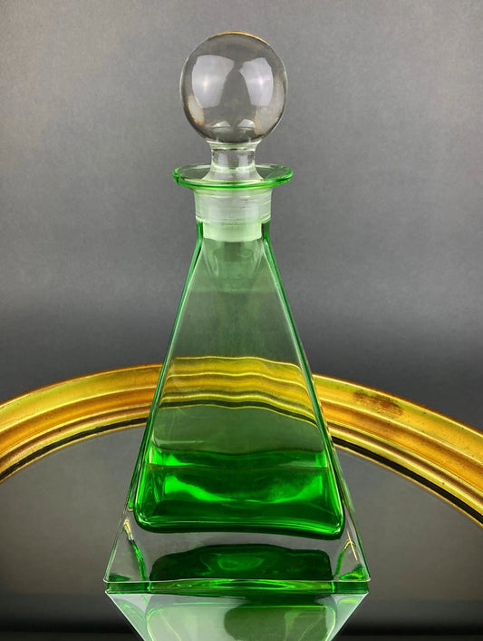Green crystal decanter with clear spherical stopper, pyramid-shaped base on Tampa Home & Garden Store