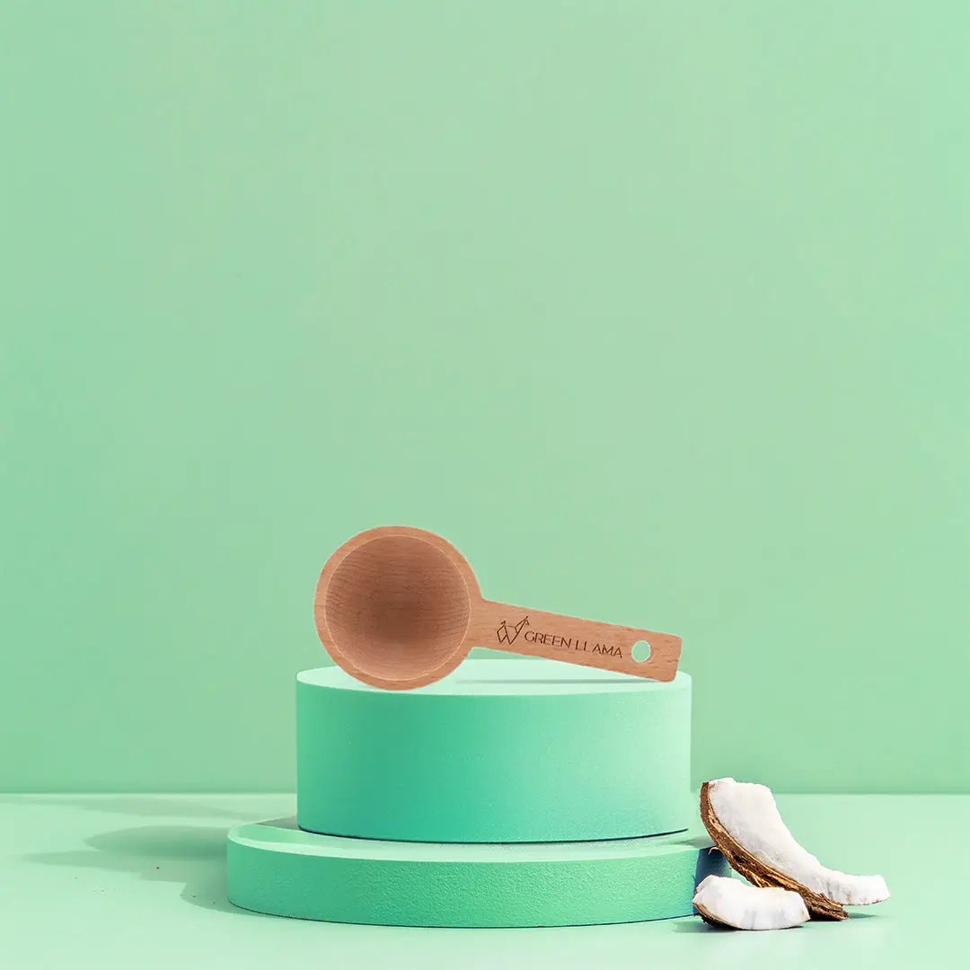Green Llama Laundry Starter Kit wooden scoop on turquoise display stands on Tampa Home & Garden Store