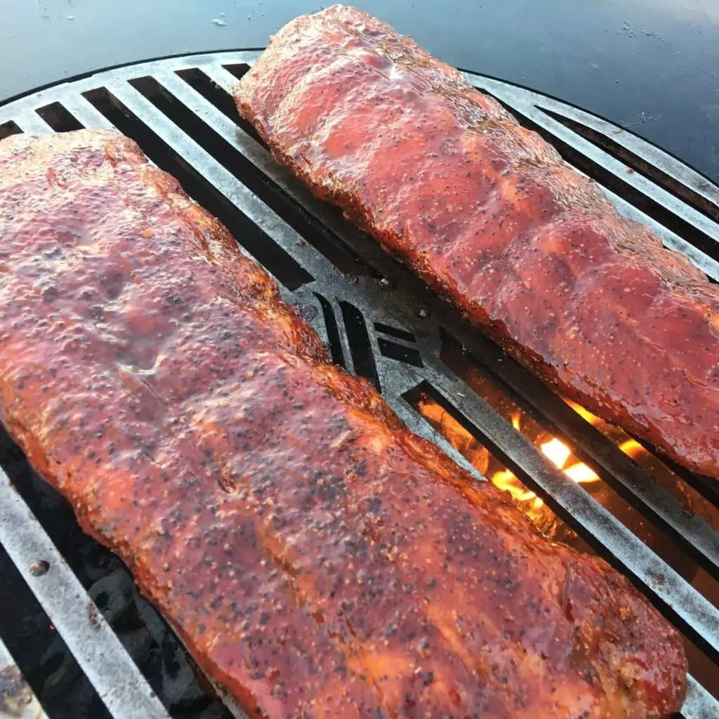 Grill Grate 20 Inch Arteflame carbon steel outdoor grate with two meat slabs on the grill on Tampa Home & Garden Store