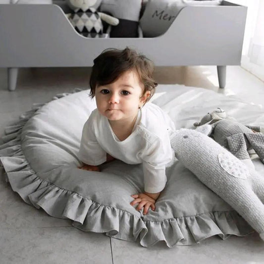 Gray round baby play mat with ruffled edge; soft padded cotton crawling rug for newborns on Tampa Home & Garden Store