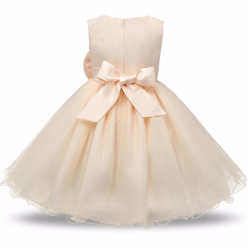 Stevvex ivory satin baby girls dress with large back bow and layered tulle skirt on Tampa Home & Garden Store
