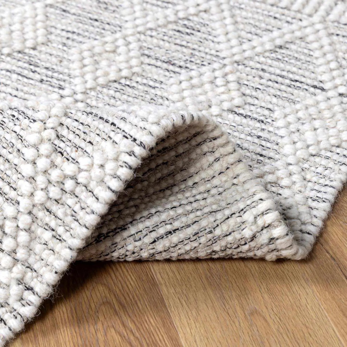 Whittington Wool Area Rug in Charcoal and White, handmade Moroccan texture, chunky loop edges on Tampa Home & Garden Store