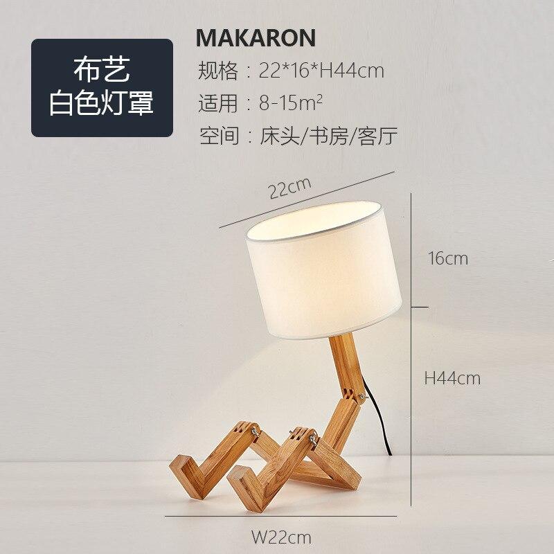 Stevvex wood robot-shaped folding table lamp with white linen shade, natural wood finish on Tampa Home & Garden Store