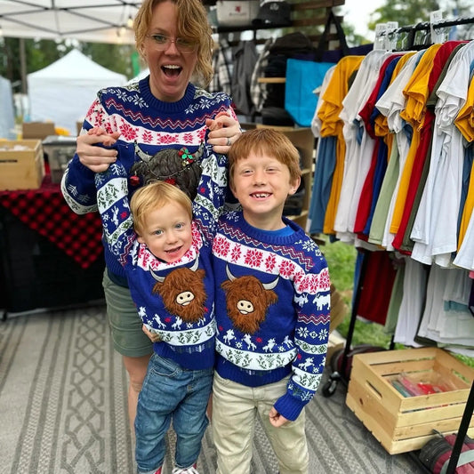 Hairy Highland Coo Ugly Christmas Sweater blue knit by Thistle & Stitch worn by 3 wearers on Tampa Home & Garden Store
