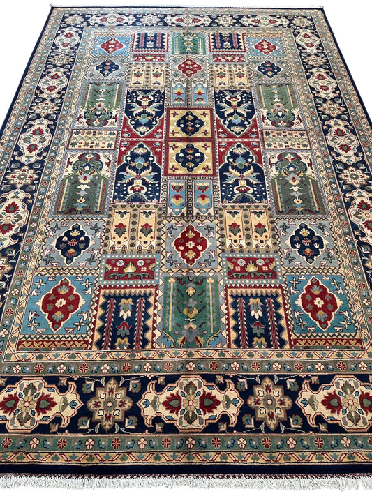 Hand-knotted Afghan Bakhtiari garden wool rug in vibrant patchwork with blues, reds and greens on Tampa Home & Garden Store