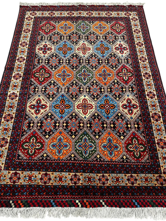 Hand-knotted Afghani Kashi wool rug with multicolor geometric medallions, intricate borders on Tampa Home & Garden Store