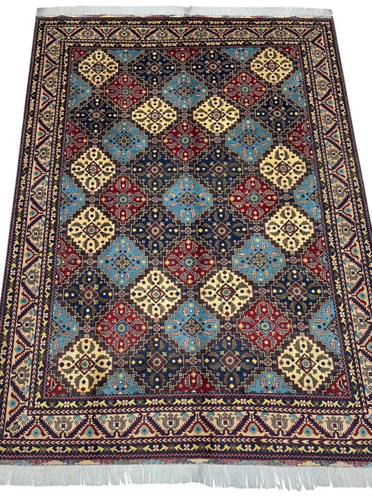 Hand-knotted Afghani Kashi wool rug by Rugistan with multicolor geometric diamond motifs on Tampa Home & Garden Store