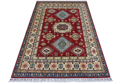 Hand knotted Afghani Kazak wool rug 4ft 10in x 6ft 6in with red field and blue medallions on Tampa Home & Garden Store