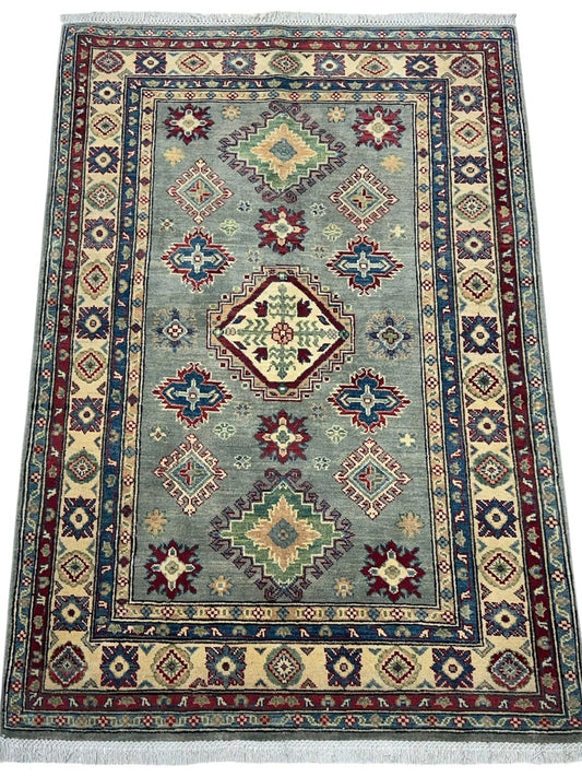 Hand knotted Afghani Kazak wool rug 4x6 with teal field and geometric medallions, fringed ends on Tampa Home & Garden Store