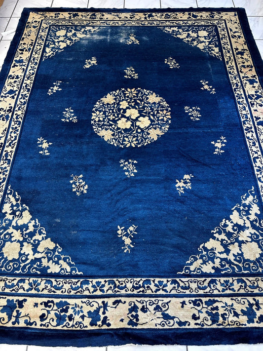 Hand knotted Peking wool rug in deep blue with ivory floral medallion and border on Tampa Home & Garden Store