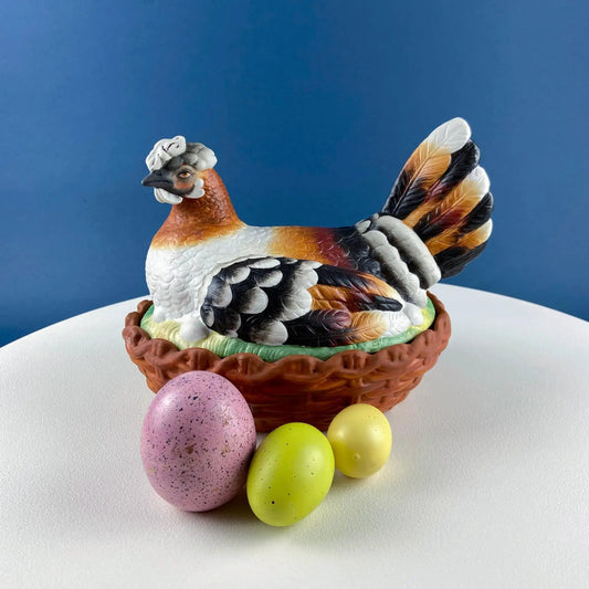 Hand Painted Hen in a Basket Butter Bowl ceramic hen on a woven basket with pastel eggs on Tampa Home & Garden Store