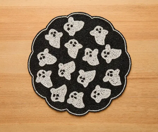 Round black beaded ghost placemat with white ghost motifs handmade Payton James Halloween decor on Tampa Home & Garden Store