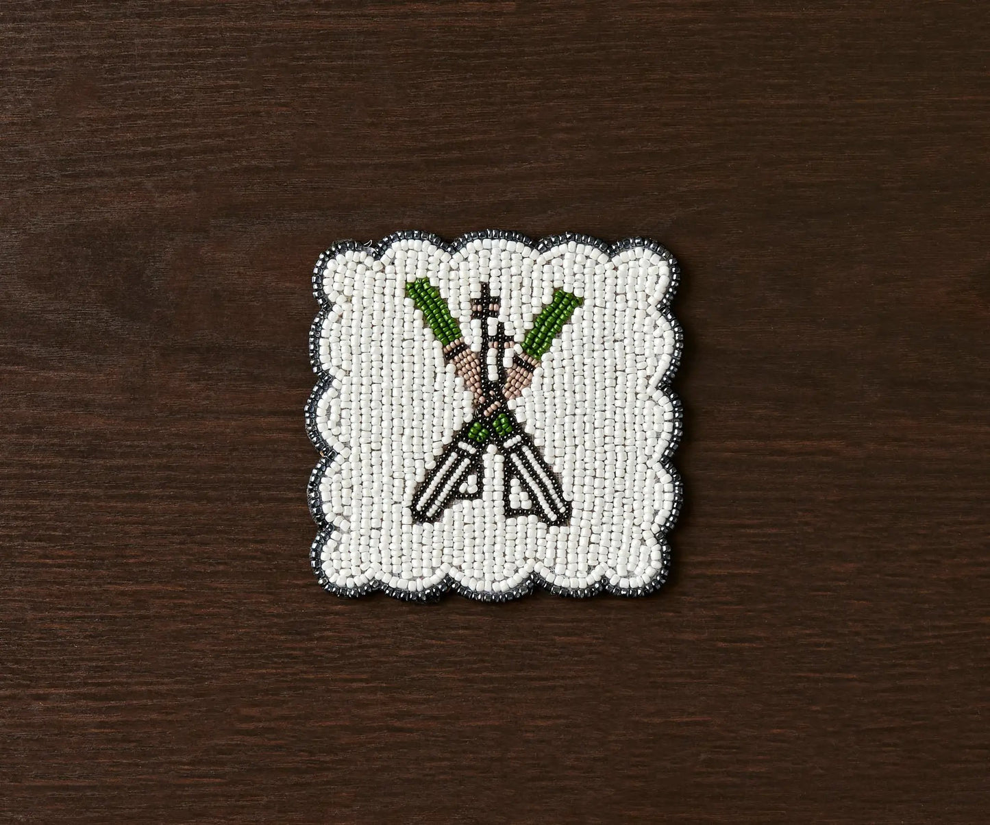 Handmade Beaded Ski Coaster with Pearls white coaster with black edge and green accents on Tampa Home & Garden Store