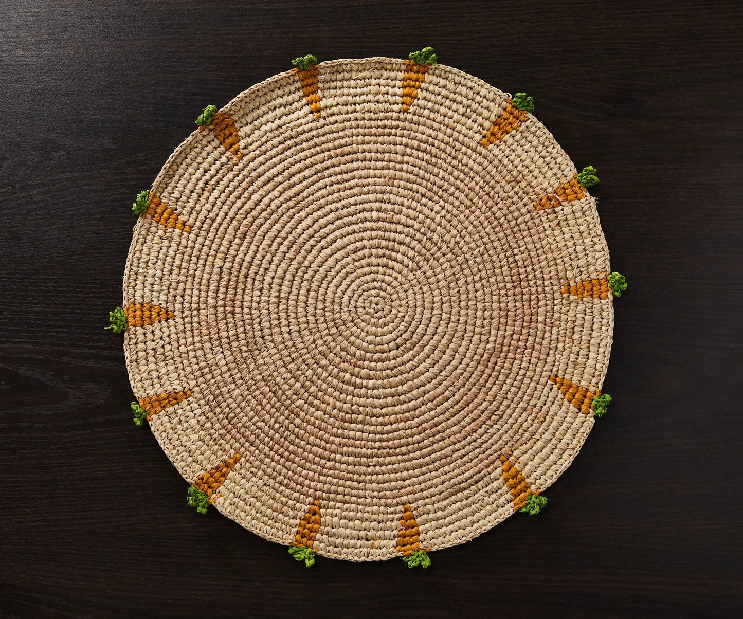 Handwoven Carrot Round Raffia Placemat in natural beige with orange stripe accents on Tampa Home & Garden Store