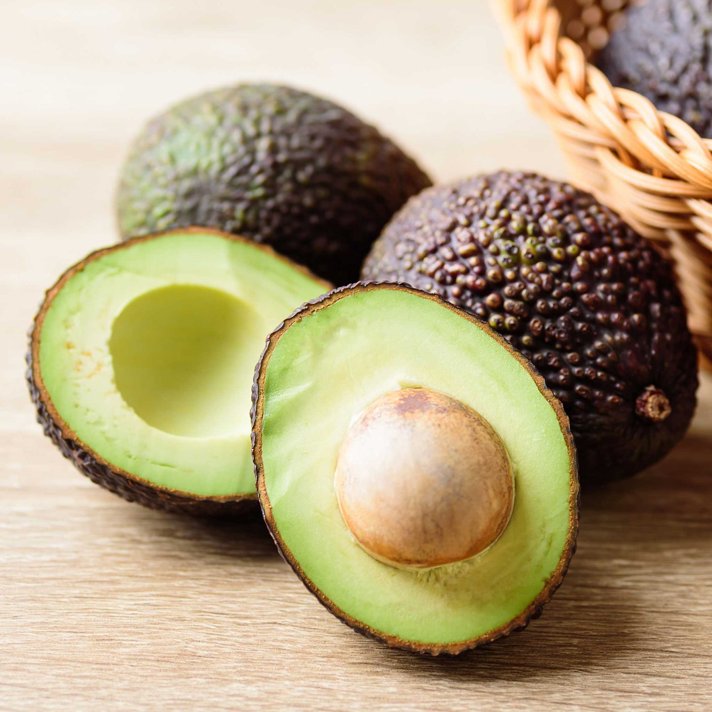 Hass Avocado Tree plant green avocados in a woven basket on Tampa Home & Garden Store