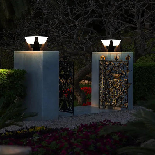 LED outdoor post light for entrance path between stone pillars and iron gate on Tampa Home & Garden Store