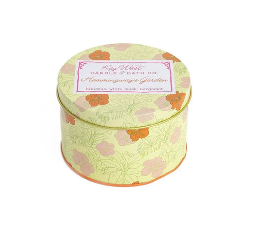 Hemingway's Garden Bergamot Hibiscus Travel Tin candle by Key West Candle & Bath Co., pale lemon-yellow floral tin on Tampa Home & Garden Store