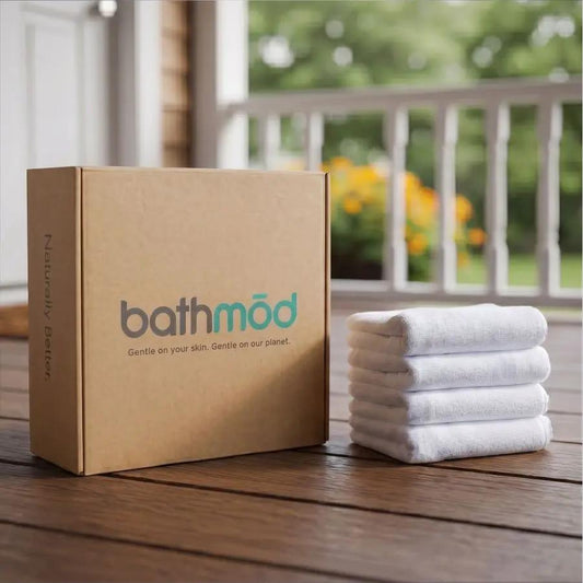 Bath mats four pack set in white organic cotton with ecobrands box on porch on Tampa Home & Garden Store