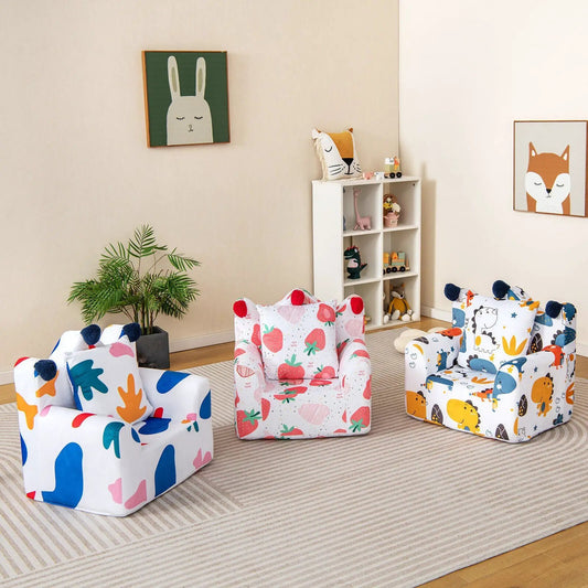 Kids sofa with armrest and extra pillow in a bright playroom with colorful printed chairs on Tampa Home & Garden Store