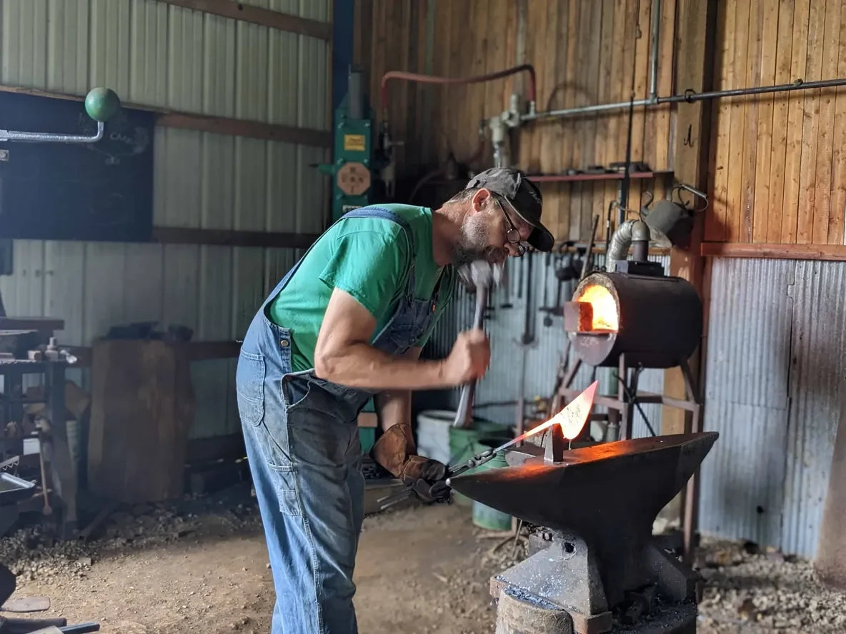 Ho Mi Hand Plow gardening tool by Homestead Iron in a blacksmith forge workshop on Tampa Home & Garden Store
