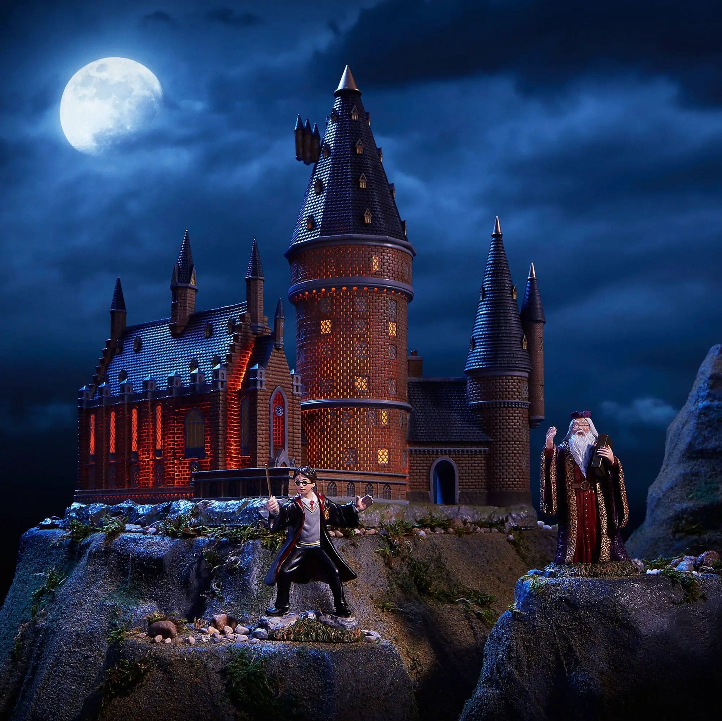 Hogwarts Great Hall & Tower Model, brick castle with blue roofs, lit windows, 2 wizards on Tampa Home & Garden Store
