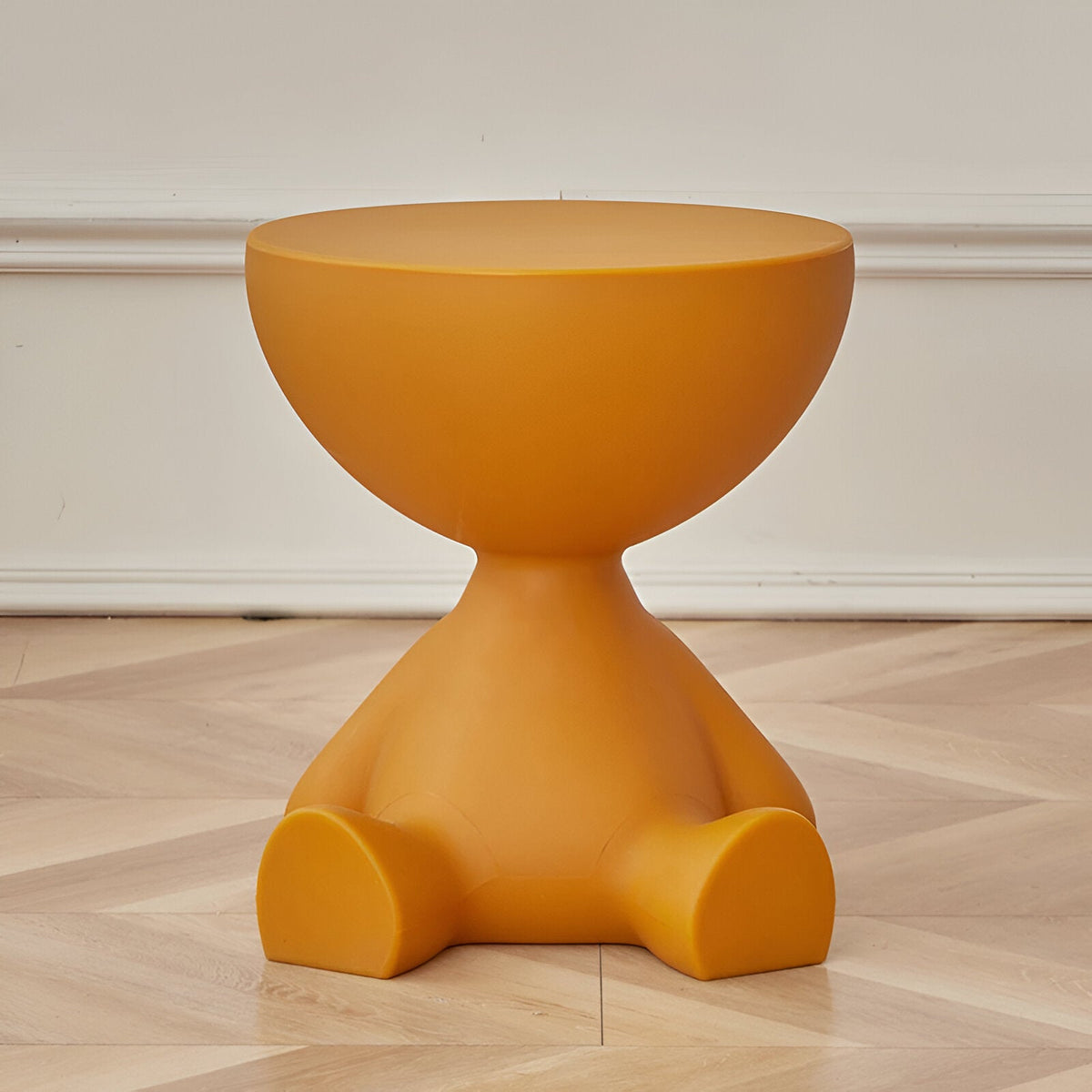 Round coffee table by Moktan Sabai in bright orange with a smooth pedestal base on Tampa Home & Garden Store
