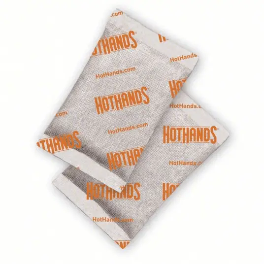 Two HotHands hand warmer sachets with white wrappers and orange branding on Tampa Home & Garden Store