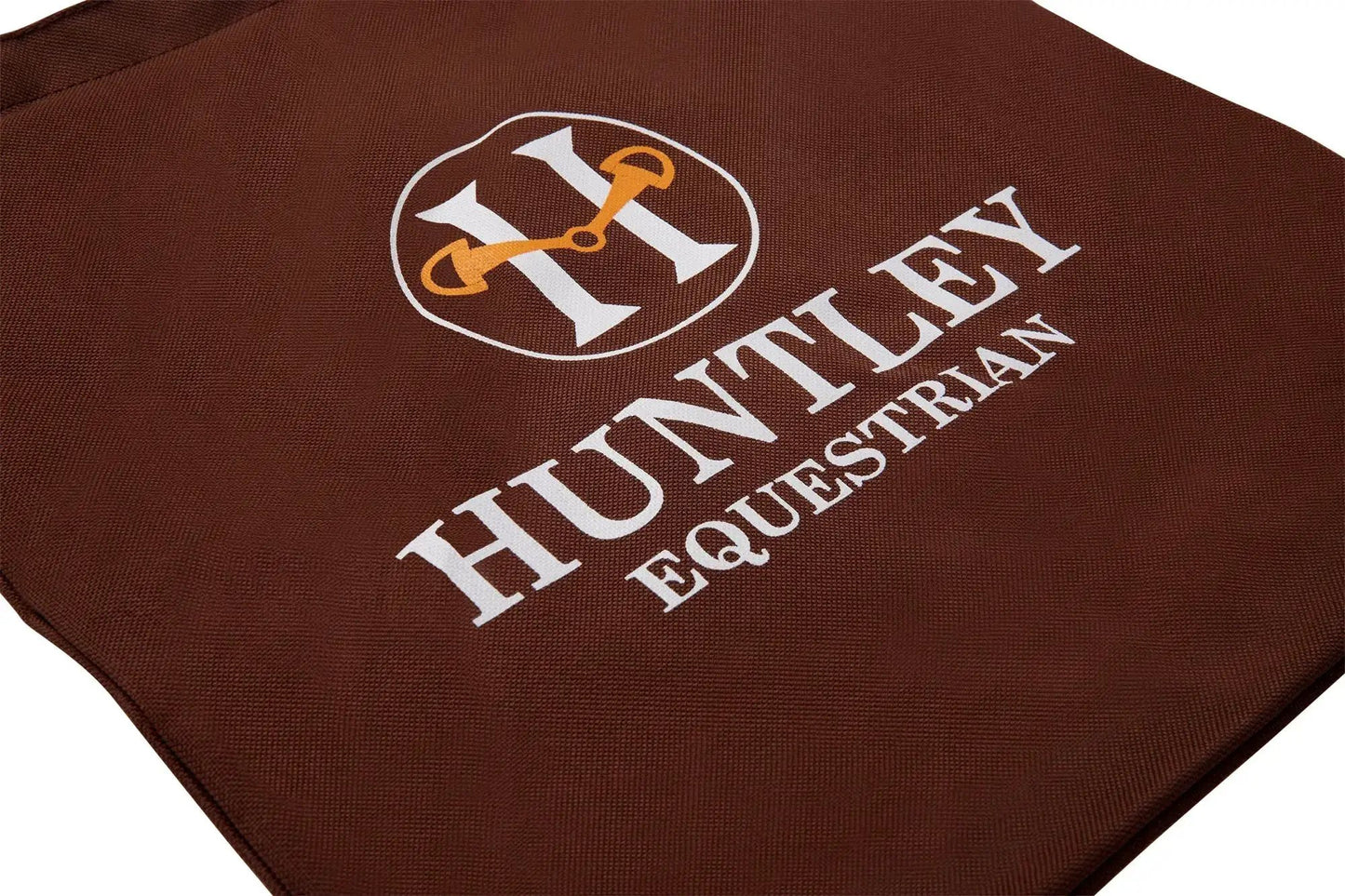 Huntley Equestrian Tote Bag in brown canvas with white logo and orange harness detail on Tampa Home & Garden Store