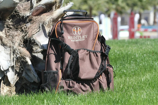 Huntley Equestrian Deluxe Backpack brown fabric with orange piping and logo on Tampa Home & Garden Store
