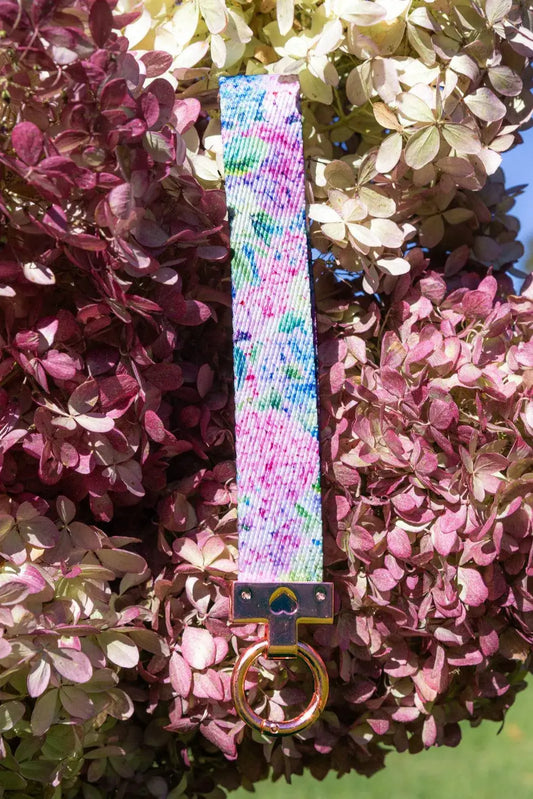 Hydrangea Haven wristlet keychain pastel tie-dye fabric strap with gold-tone cross hardware on Tampa Home & Garden Store