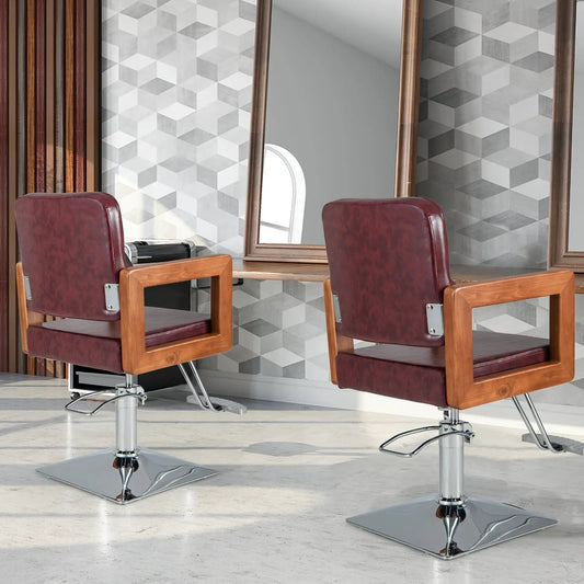 Hydraulic barber chair red with wood armrests and chrome pedestal base in a two-chair salon on Tampa Home & Garden Store