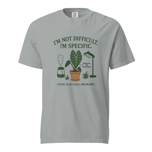 Light gray tee with I’M NOT DIFFICULT. I’M SPECIFIC plant graphic, Comfort Colors label on Tampa Home & Garden Store