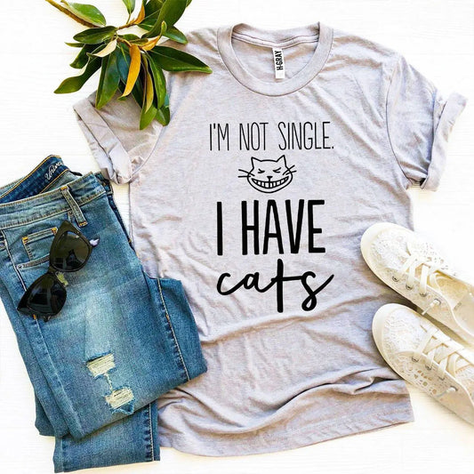Not Single I Have Cats T-shirt in gray with bold black text and grinning cat graphic on Tampa Home & Garden Store
