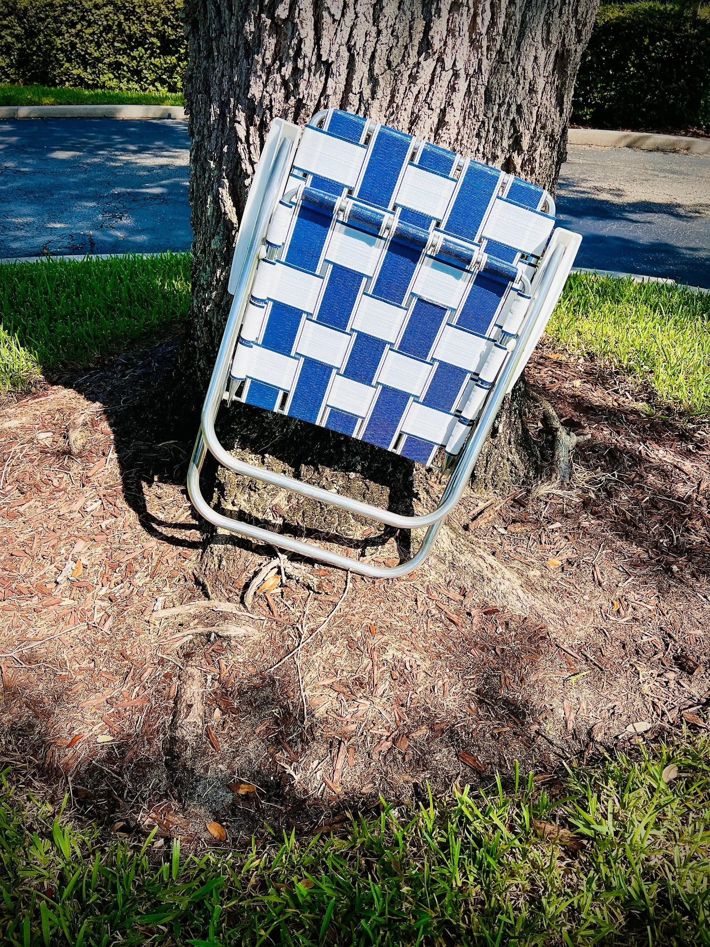 Saint Augustine Classic Outdoor Lawn Chair with blue and white woven fabric on aluminum frame on Tampa Home & Garden Store