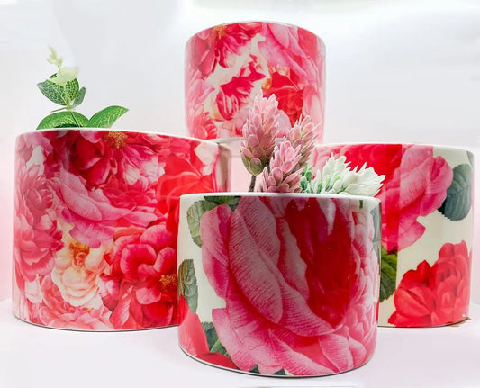 Rose Marie floral cachepots and patterned vases by Gia Roma, four pink rose-print ceramics on Tampa Home & Garden Store