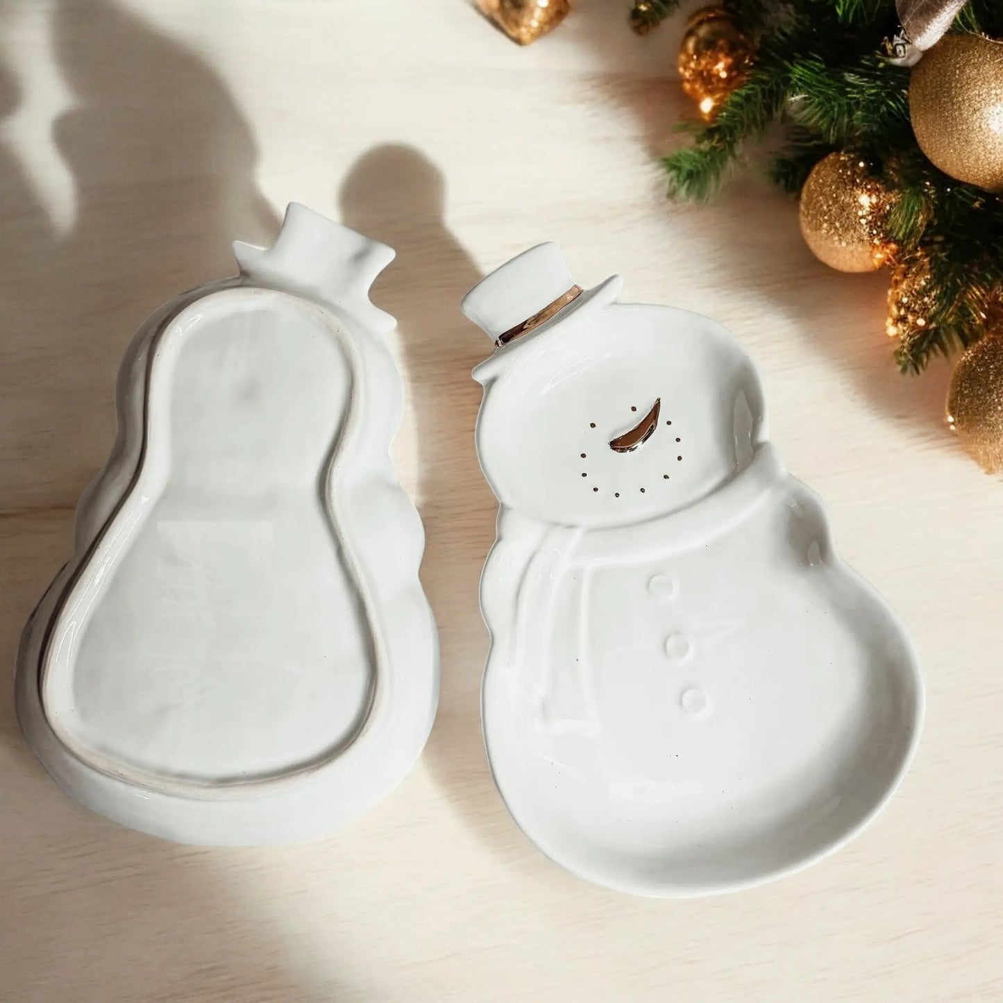 Two white ceramic snowman serving dishes with gold accents for charcuterie by Gia Roma on Tampa Home & Garden Store