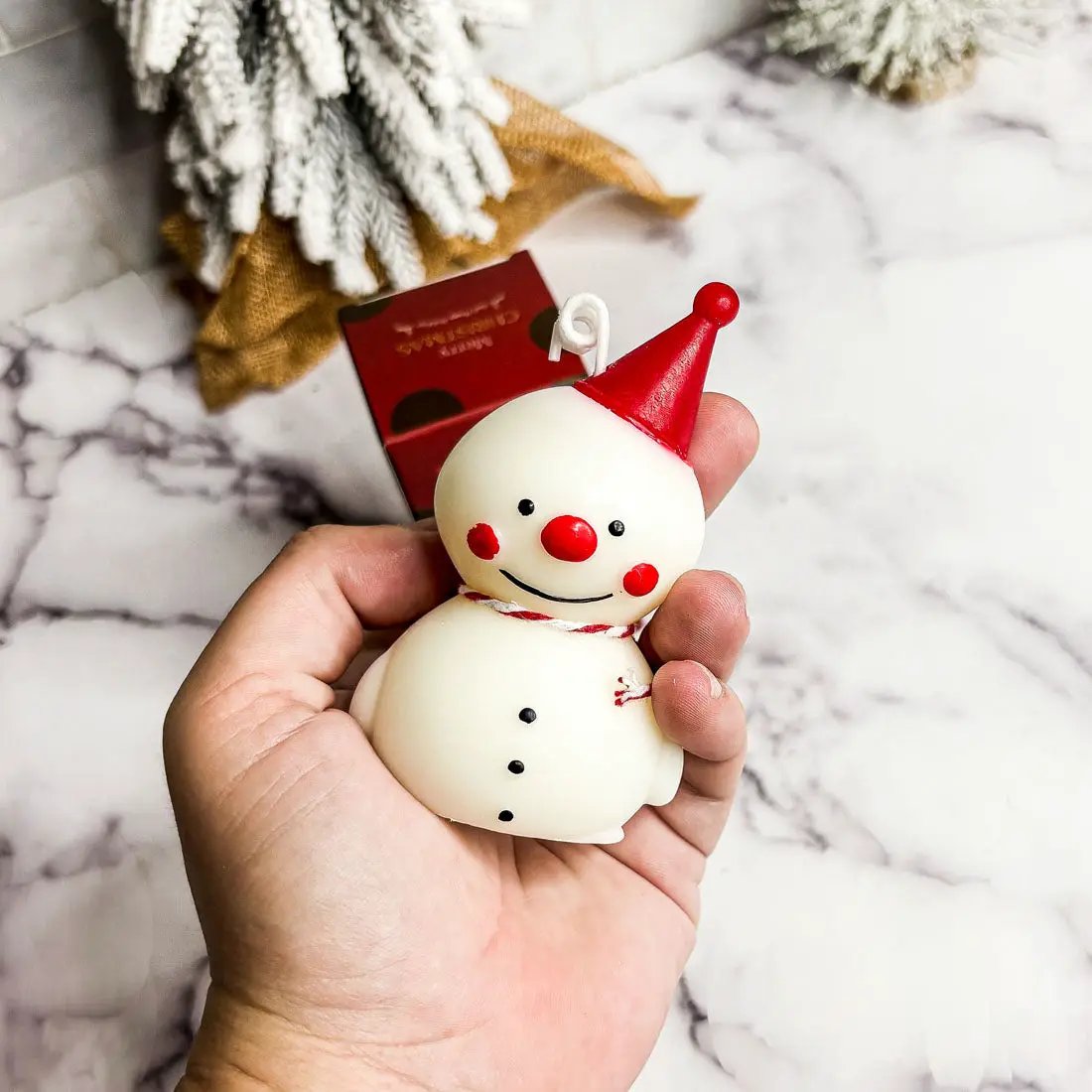 Snowman-shaped mini scented candle with red hat and nose by Gia Roma on Tampa Home & Garden Store