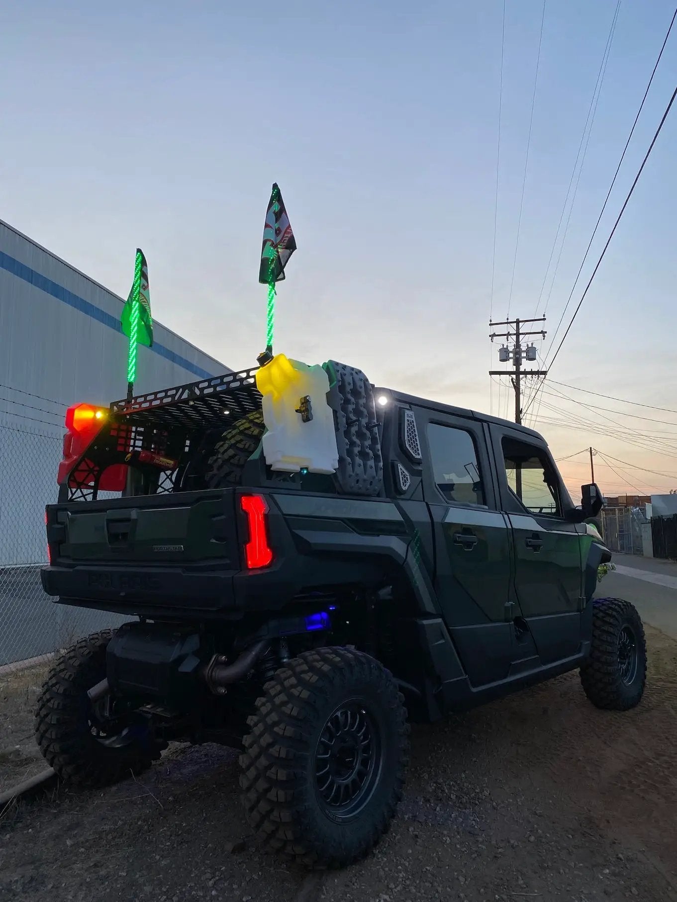 GP5 LED Pod Light Amber with clear lens on a lifted pickup with roof rack and green LEDs on Tampa Home & Garden Store