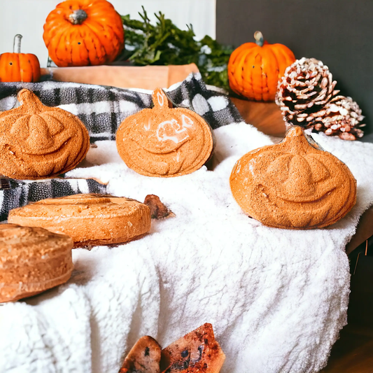 Pumpkin Spice Bath Bombs Gia Roma set of orange pumpkin shapes on a snowy display on Tampa Home & Garden Store