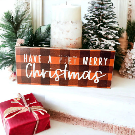 Red buffalo check Christmas sign with white script Have a Very Merry Christmas on Tampa Home & Garden Store