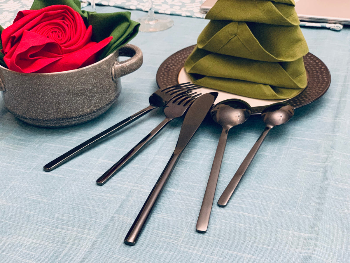 Vibhsa black stainless steel 20 pc flatware set with red rose centerpiece on table on Tampa Home & Garden Store
