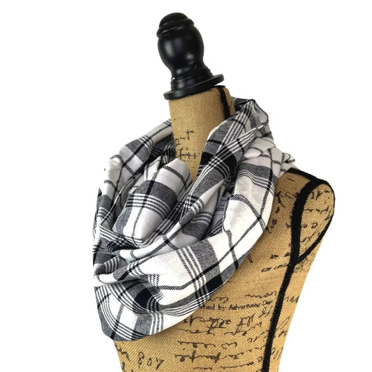 White and Black Plaid Flannel Infinity Scarf by Thistle & Stitch wrapped on a dress form on Tampa Home & Garden Store
