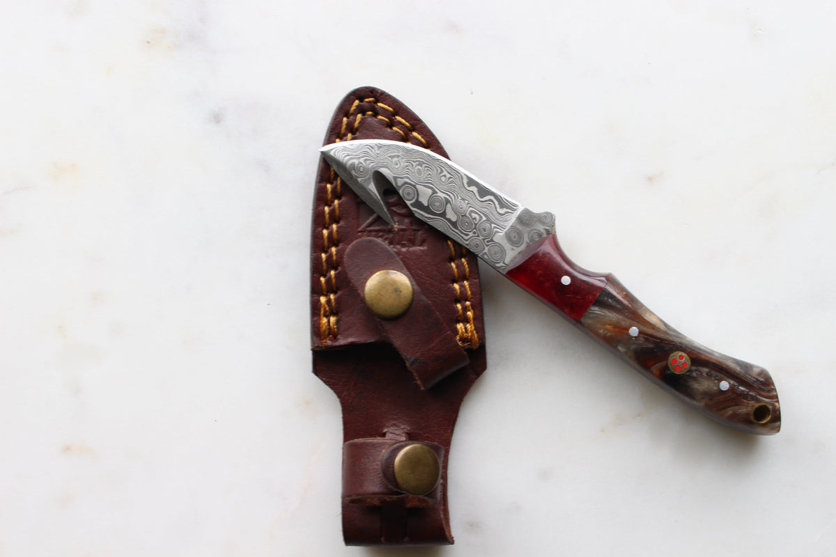 Ravager Damascus gut-hook hunting knife TK-400 with swirl blade and handle, brown leather sheath on Tampa Home & Garden Store